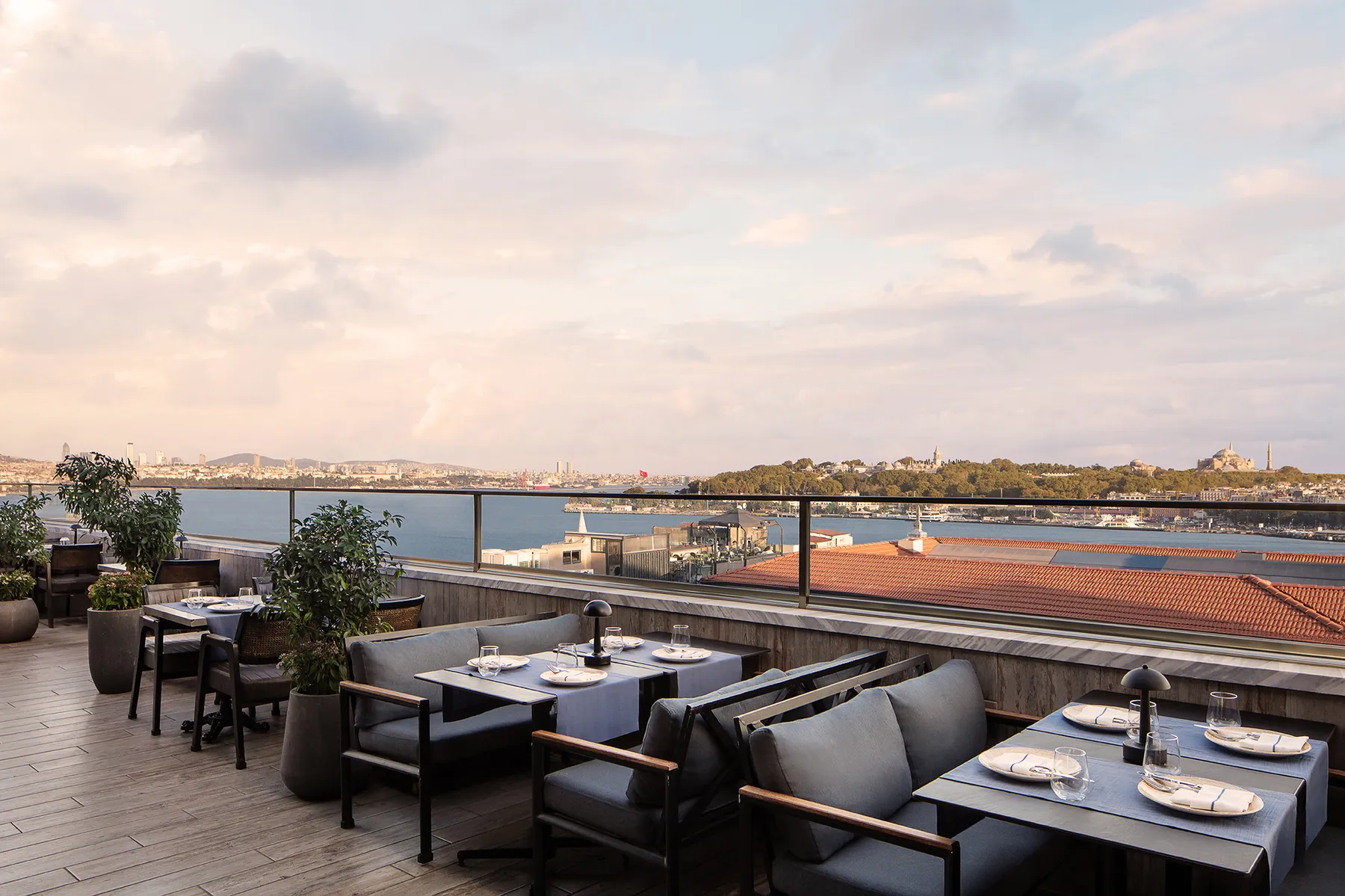 Moise Karaköy terrace tables overlooking the Bosphorus at sunset