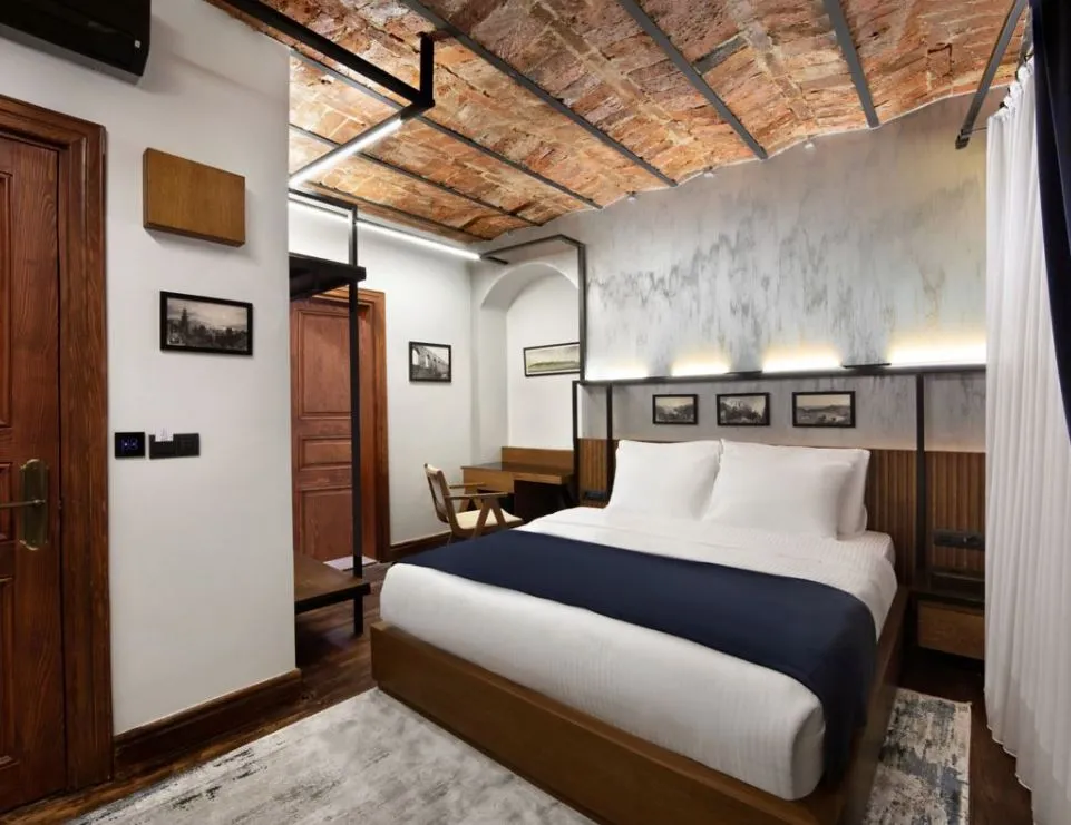 House Building guest room with a vaulted brick ceiling