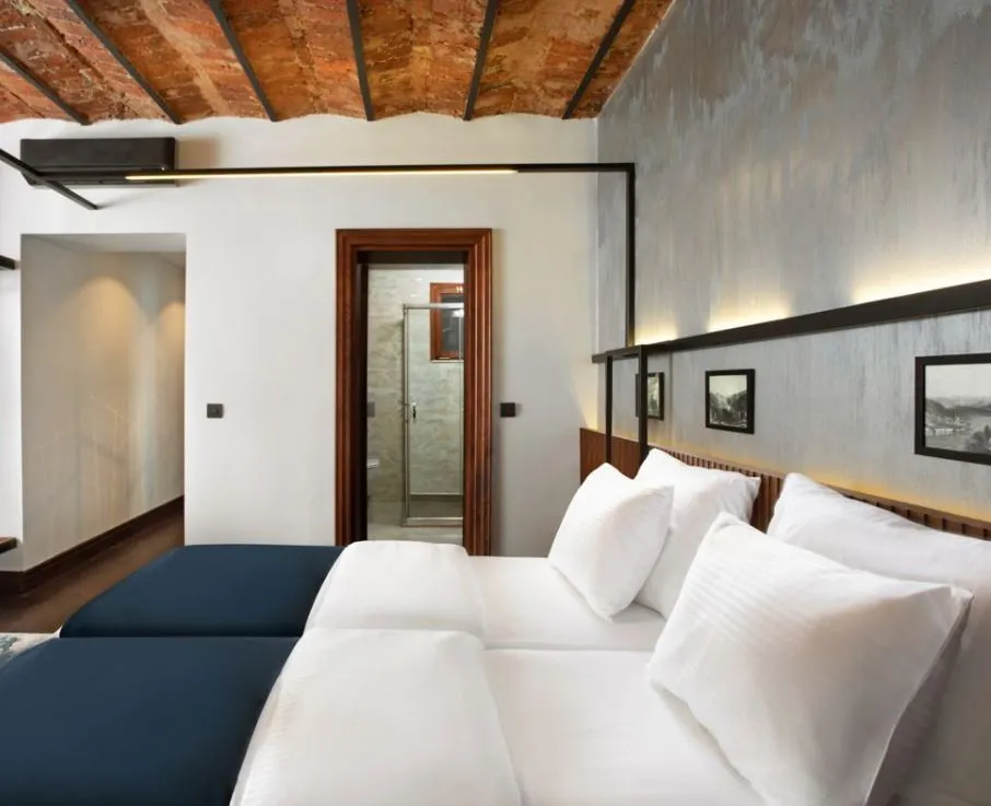 House Building guest room with timber beams