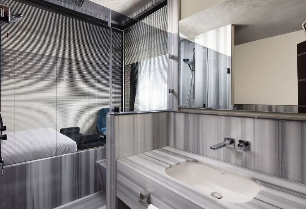 Banque Building bathroom with a marble washbasin