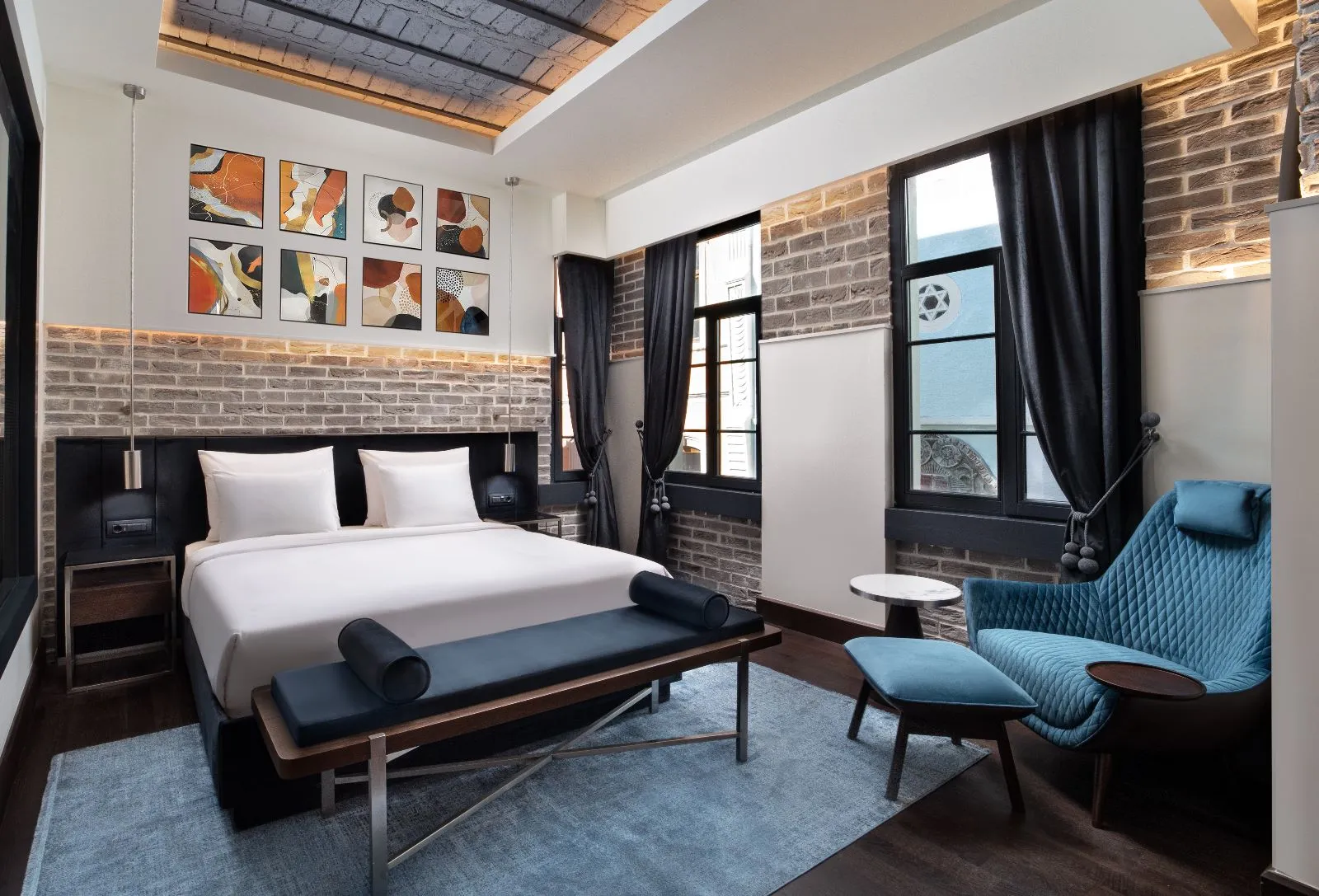 Banque Building guest room with a King bed and an armchair