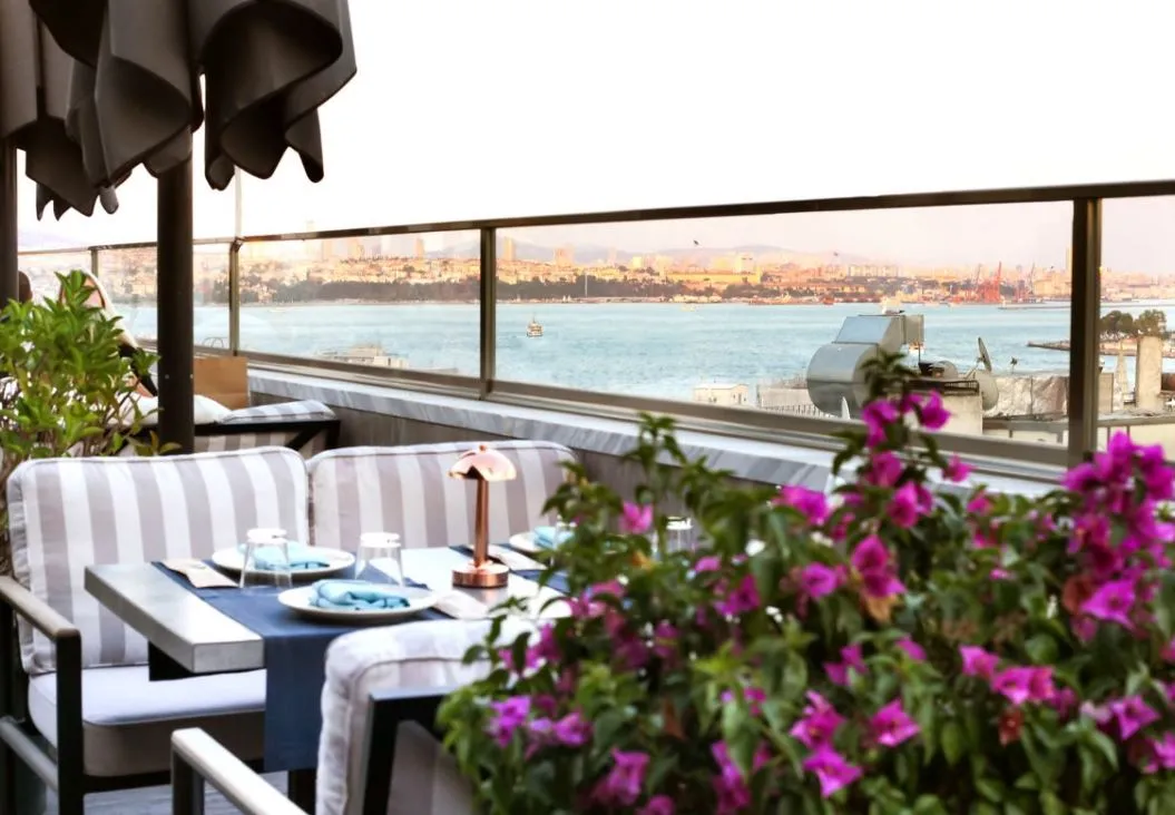 Terrace table with flowers and a sea view