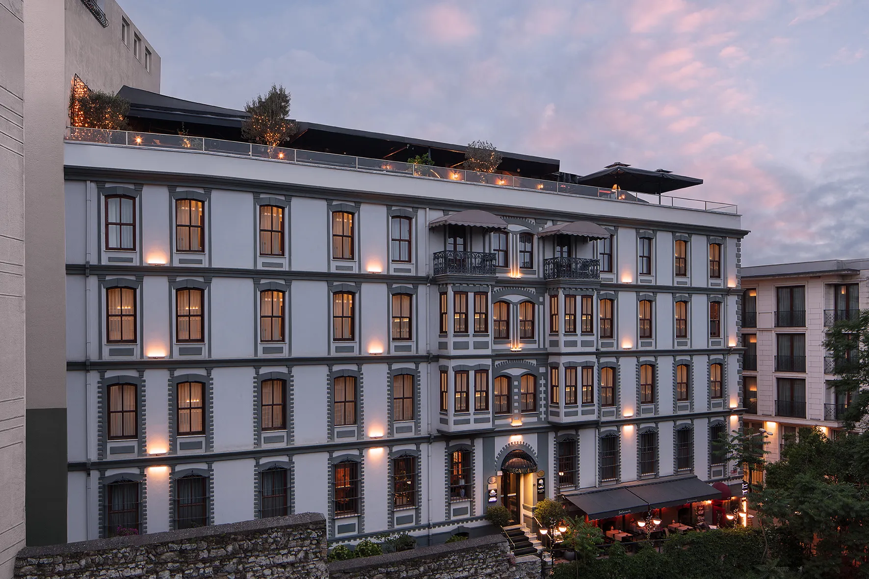 The House Building of DeCamondo Galata lit up at dusk