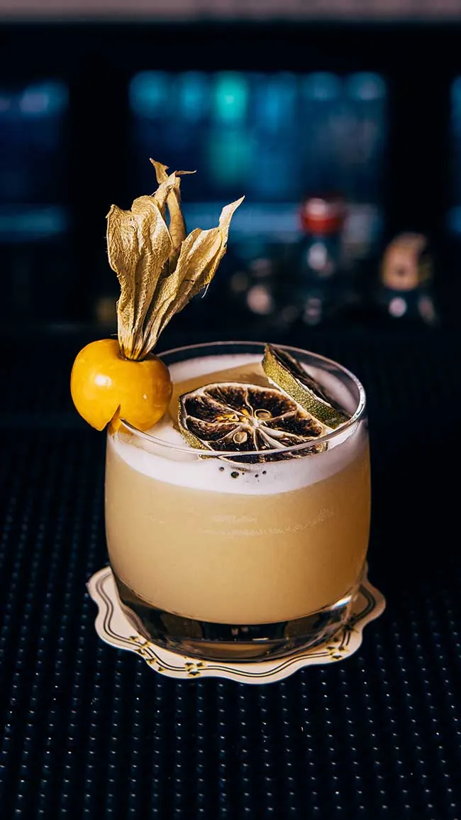 Signature cocktail with a dried citrus garnish