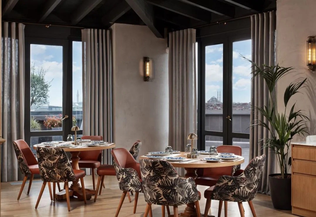 Tables by the tall windows at Béatrice