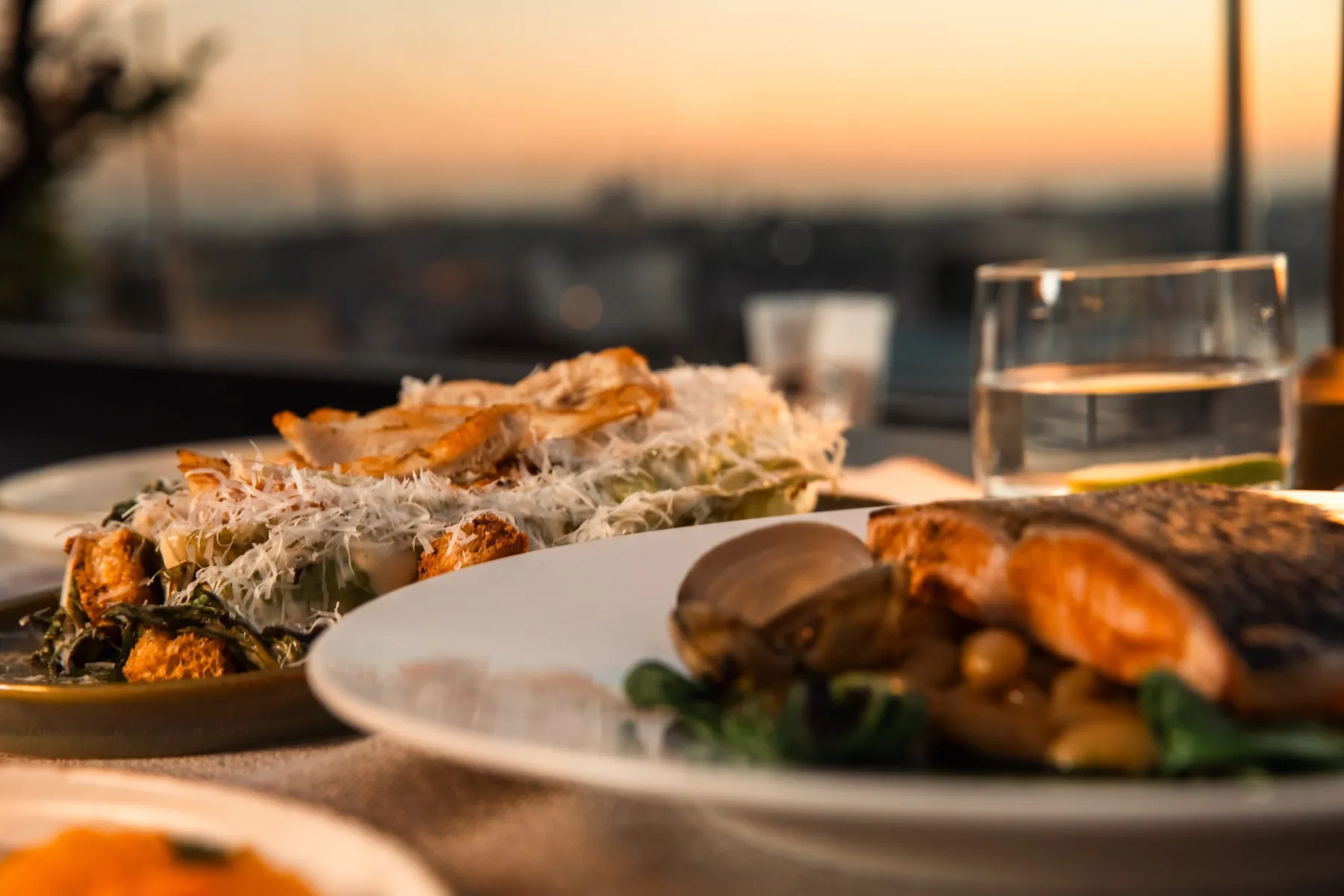 Dishes served on the terrace at golden hour