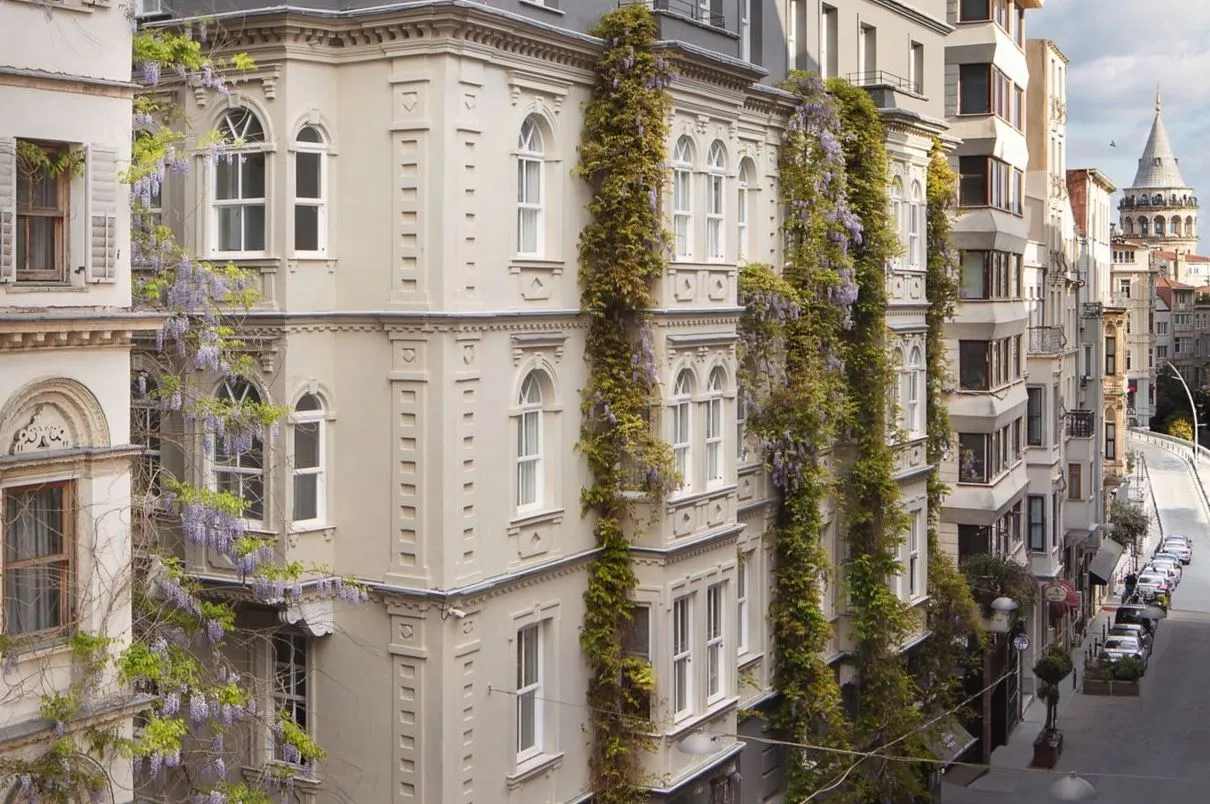 Wisteria-covered façade with Galata Tower in the distance