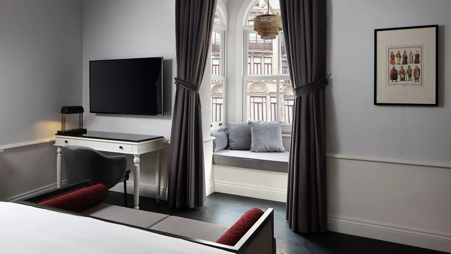 Grand Pera Corner room with a desk, television and window seat