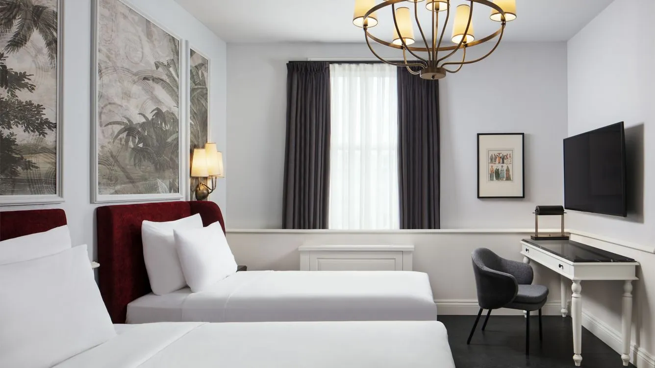 Premium Twin room with two beds, desk and television